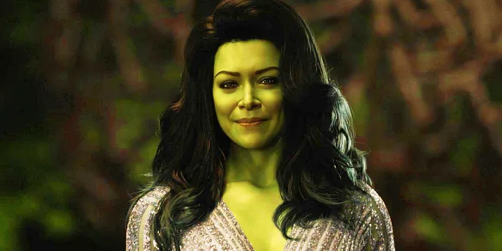 She-Hulk character smiling warmly in a sparkly dress against a green bokeh background.
