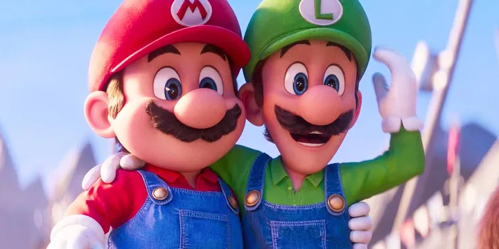 Animated Mario and Luigi hug cheerfully in a bright outdoor setting.