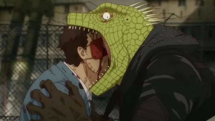 Anime scene of a lizard-like monster biting a glasses-wearing male character near a fence.