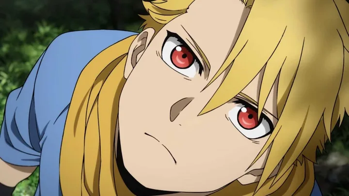 Close-up of a blonde anime character with striking red eyes in an outdoor forest setting.