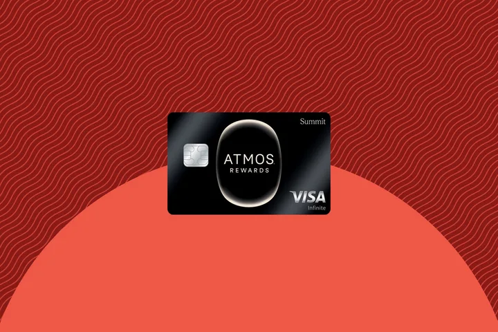 Atmos Rewards Summit Visa Infinite credit card on a red patterned background.
