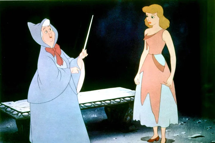 Animated Disney scene of the Fairy Godmother waving a wand at Cinderella in a torn dress.